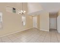 Spacious open-concept living room with tile floors, high ceilings, and natural light at 3037 Austin Pale Ave, North Las Vegas, NV 89081