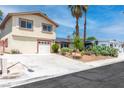 Well-maintained two-story home with a two-car garage and desert landscaping at 3793 Casa Colorado Ave, Las Vegas, NV 89121