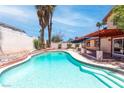 Sparkling pool with a tanning ledge and patio area, perfect for relaxation and entertaining at 3793 Casa Colorado Ave, Las Vegas, NV 89121