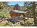 Charming two-story home with a deck, set in a beautiful, wooded environment at 3971 Arlberg Way, Mount Charleston, NV 89124
