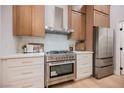 Modern kitchen featuring stainless steel appliances, custom cabinetry, and elegant countertops at 4065 Genoa Dr, Las Vegas, NV 89141