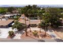 Spacious single-story home boasting a swimming pool and lush landscaping with desert accents at 4219 E Pinecrest Cir, Las Vegas, NV 89121