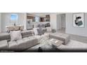 Open concept living room and kitchen with stainless appliances, lots of light, and dining area at 4709 Woodland Ave # Lot 22, Las Vegas, NV 89121