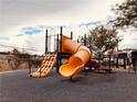 Neighborhood playground features a fun, colorful slide to keep children entertained at 62 E Serene Ave # 115, Las Vegas, NV 89123