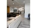 Spacious open-concept living room with modern flooring, connecting to the kitchen and dining area at 621 S 9Th St, Las Vegas, NV 89101