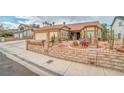 Attractive single-story home showcasing desert landscaping with cacti and a well-manicured front yard at 6508 Peppermill Dr, Las Vegas, NV 89146
