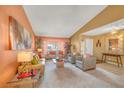 Bright and airy living room with plush seating, a decorative mirror, and ample natural light at 6508 Peppermill Dr, Las Vegas, NV 89146