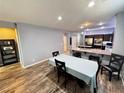 Eat in kitchen with bar seating looking into dining room and an open-concept floor plan at 7035 Thistle Ridge St, Las Vegas, NV 89166