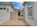 Gated courtyard entrance with stone accents leading to the front door at 7606 Grove Acre Ct, Las Vegas, NV 89131