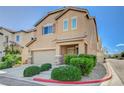 Attractive two-story home offers a two-car garage and well-maintained front yard with lush bushes at 7963 Cape Brett St, Las Vegas, NV 89131