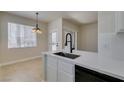 Eat-in kitchen with modern finishes including stainless sink and faucet, and natural light at 9050 W Warm Springs Rd # 1117, Las Vegas, NV 89148