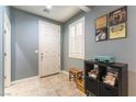 Inviting entryway with tiled flooring, shuttered window and decorative accents at 10229 Mayflower Bay Ave, Las Vegas, NV 89166