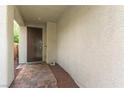 Covered entryway with brick pavers leading to the front door at 10229 Mayflower Bay Ave, Las Vegas, NV 89166