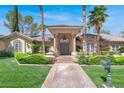 Charming one-story residence boasting a covered entry and mature landscaping, adding elegance at 1813 Skyline Dr, Las Vegas, NV 89117