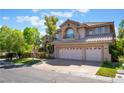 Beautiful two-story home boasting a well-manicured lawn and a spacious three-car garage at 2008 Aspen Oak St, Las Vegas, NV 89134