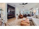 Elegant living room with an open-concept design, seamlessly connecting to the modern kitchen at 2107 Desert Woods Dr, Henderson, NV 89012