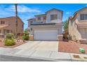 Charming two-story home featuring a two car garage, desert landscaping, and solar panels in a residential neighborhood at 217 Turkey Creek Way, Henderson, NV 89074
