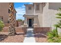 Inviting front entrance showcasing the home's facade and landscaping, including a palm tree at 217 Turkey Creek Way, Henderson, NV 89074