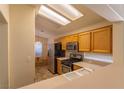 Well-lit kitchen with stainless steel appliances and a breakfast nook at 2173 Point Mallard Dr, Henderson, NV 89012