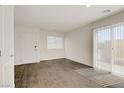 Bright living room features wood floors, a slider to backyard and ample space at 2773 Green Envy Ave # 245, North Las Vegas, NV 89086