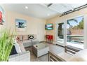 Relaxing pool room with lounge seating and direct access to the pool and backyard at 2829 Via Florentine St, Henderson, NV 89074