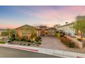 Beautiful home with a well-manicured front yard and brick driveway at 35 Via Rizzuto, Henderson, NV 89011