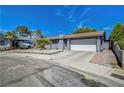 Beautiful single-story home featuring a two-car garage and a well-manicured, low-maintenance front yard at 4556 Kenilworth Ct, Las Vegas, NV 89147