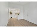 Sunlit living room features minimalist decor, light wood floors, and neutral walls for a modern, open feel at 5171 Lindell Rd # 201, Las Vegas, NV 89118