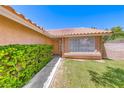 Inviting front entrance with a cozy porch, tidy landscaping, and a well-maintained lawn at 5639 Guiding Star Cir, North Las Vegas, NV 89031