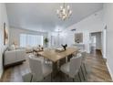 Bright open-concept living and dining area with neutral tones, light wood floors, and stylish furniture at 5639 Guiding Star Cir, North Las Vegas, NV 89031