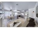 Stylish open-concept living area with tile floors, a modern fireplace, and an eat-in kitchen at 5639 Guiding Star Cir, North Las Vegas, NV 89031