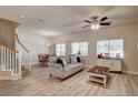 Open living space with wood-look floors, a dining area, and plenty of natural light at 67 Dow Jones St # 2, Henderson, NV 89074
