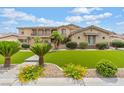 Attractive home featuring a well-manicured lawn, a three-car garage, and a spacious driveway at 7001 Via Locanda Ave, Las Vegas, NV 89131