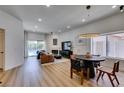 Bright living room features wood floors, recessed lighting and a modern fireplace at 8640 Trafalgar Dr, Las Vegas, NV 89117