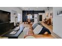 Spacious living room featuring modern lighting, built-in shelves, and stylish decor at 8640 Trafalgar Dr, Las Vegas, NV 89117