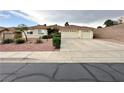 Charming single-story home featuring a two-car garage and low maintenance landscaping at 1006 Winding Hill St, Henderson, NV 89002