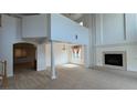 Bright living room with a fireplace and high ceilings at 10066 Golden Bluff Ave, Las Vegas, NV 89148