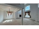 Spacious Living Room with lots of natural light and a beautiful fireplace at 10066 Golden Bluff Ave, Las Vegas, NV 89148