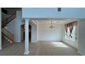 Bright living room with a staircase and an open floor plan at 10066 Golden Bluff Ave, Las Vegas, NV 89148