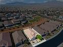 An aerial view shows the community in the desert, with the home outlined in white at 10416 Skye Arroyo Ave, Las Vegas, NV 89166