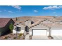 Beautiful single-story home with a two-car garage and desert landscaping, showcasing its appealing curb appeal at 11082 Sospel Pl, Las Vegas, NV 89141