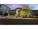 Attractive single-Gathering home featuring a brick driveway and desert landscaping, creating a welcoming entryway at 11672 Barga Ct, Las Vegas, NV 89138