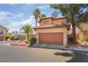 Charming two-story home with a two-car garage, a tile roof, and well-maintained landscaping at 1220 Padre Serra Ln, Las Vegas, NV 89134