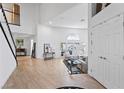 Open-concept living area with wood floors, white walls, and abundant natural light at 15 Pheasant Ridge Dr, Henderson, NV 89014
