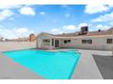 Backyard view featuring a refreshing private pool with built-in steps and a spacious patio area for entertaining at 1905 E Oakey Blvd, Las Vegas, NV 89104