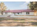 Spacious single-story home with a red tile roof, white stucco and desert landscaping at 1917 N Moapa Valley Blvd, Logandale, NV 89021