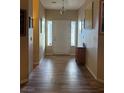 Inviting entryway features wood-look flooring, neutral paint and side windows that let in natural light at 2267 Muir Ct, Henderson, NV 89052