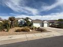 Attractive single-story home showcasing a well-manicured desert landscape, complemented by drought-resistant plants at 2267 Muir Ct, Henderson, NV 89052
