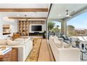 Stylish living room showcasing built-in shelving, fireplace, expansive sliding doors to integrate indoor/outdoor living at 2820 High Range Dr, Las Vegas, NV 89134