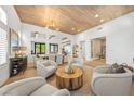 Bright living room featuring vaulted ceilings, wood floors, an open floorplan and ample seating at 2820 High Range Dr, Las Vegas, NV 89134